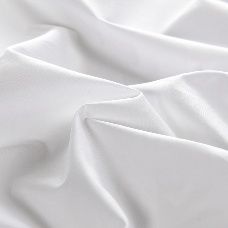 White percale bed sheets close up